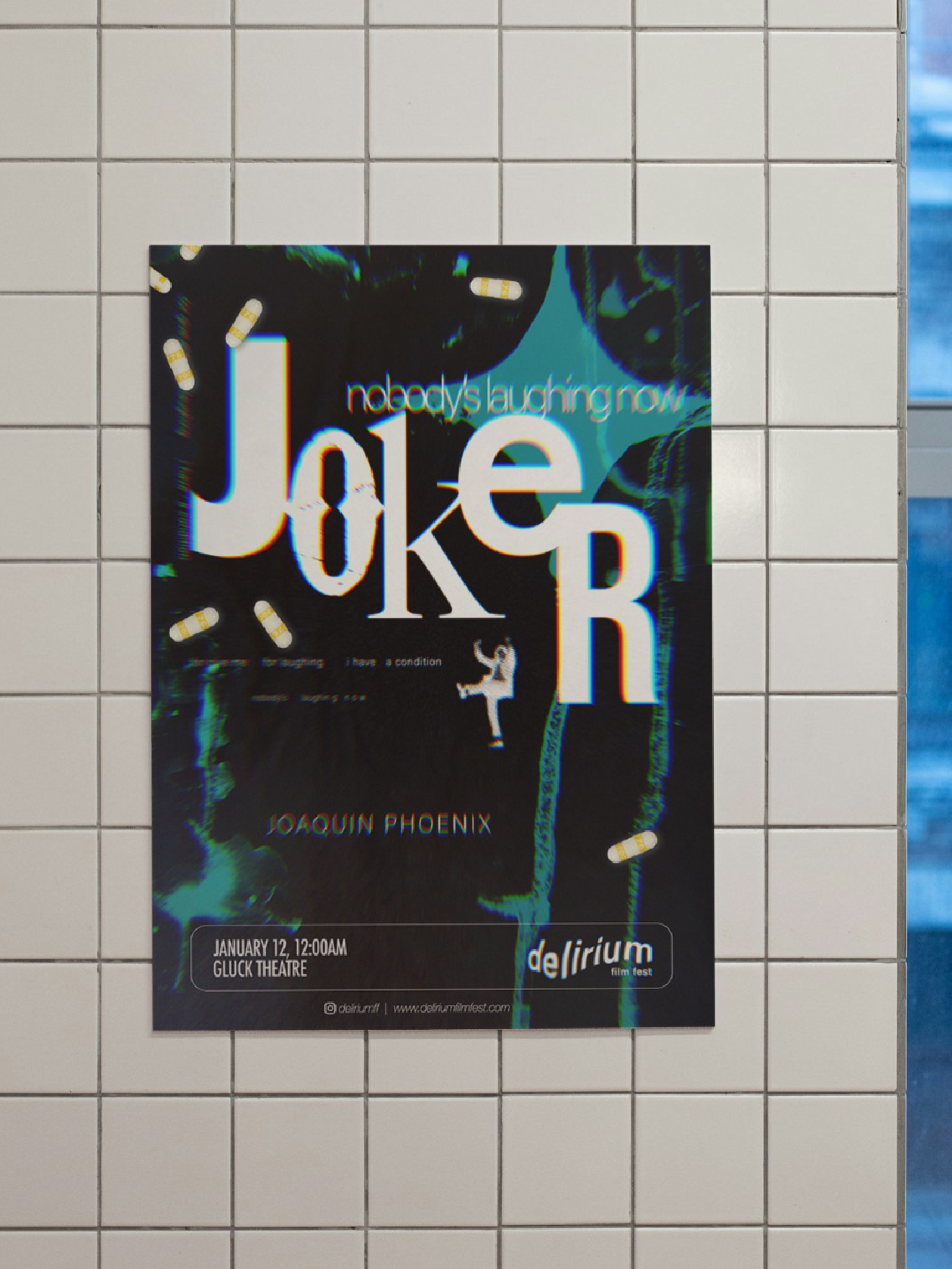 mock up of joker poster, black backgound with disjointed type treatment and teal dripping paint